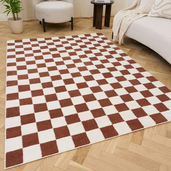 Living room with a checkered rug, beige sofa, and ideal for high traffic areas