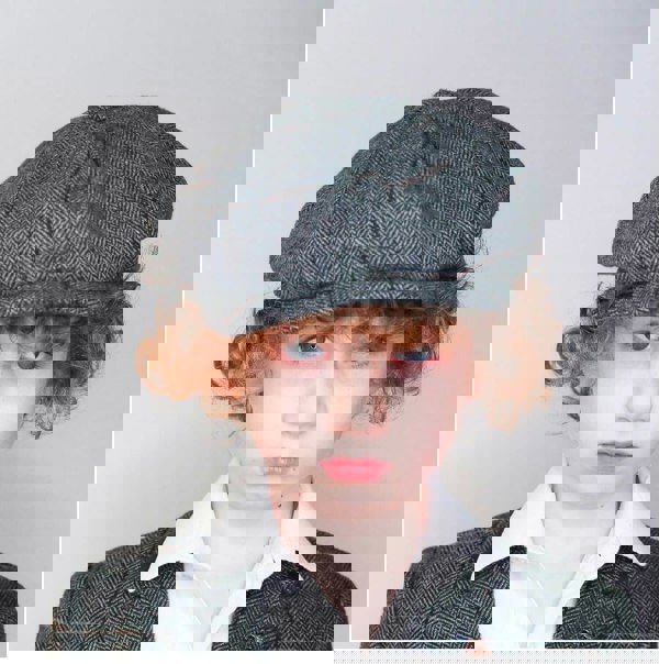 Boy wearing baker boy cap