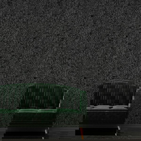 Pop black flock on dark grey wallpaper with green velvet sofa