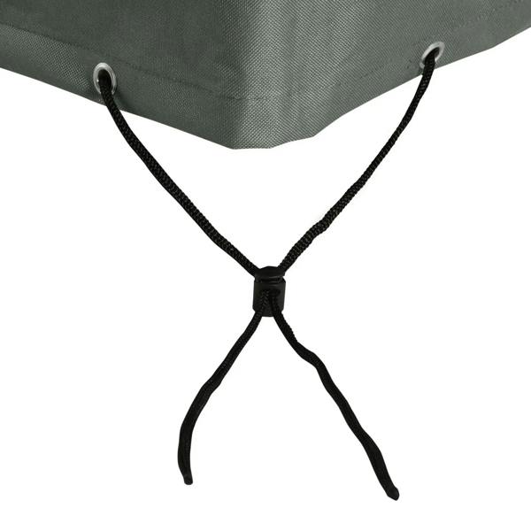 Dark gray sofa cover with cross tie straps connected to grommet points at the hem.