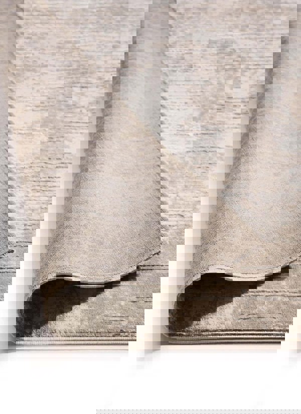 Abstract geometric rug with soft beige texture, featuring a stylish striped design for modern eco-conscious decor.