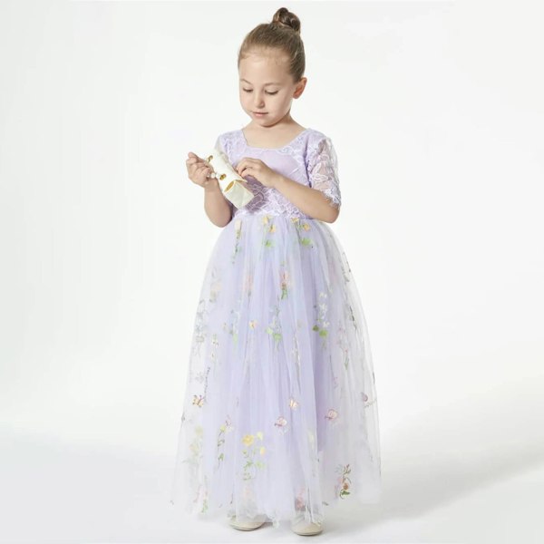 girl wearing a lilac embroidered dress 