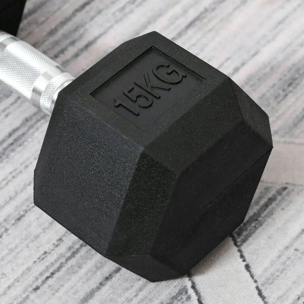 Close-up of black rubber hex dumbbell head with embossed “15kg” weight mark.