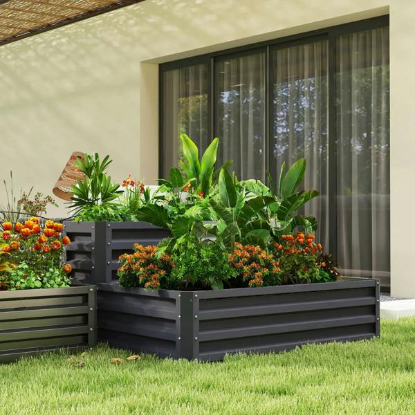 Dark grey two-tier raised garden planter with mixed flowers, herbs, and greenery
