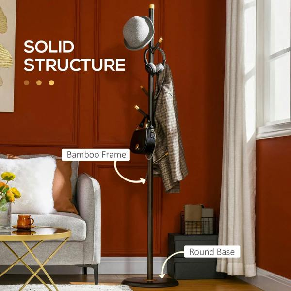 Coat rack stand with solid frame, gold accents, round base, and hanging coat near sofa