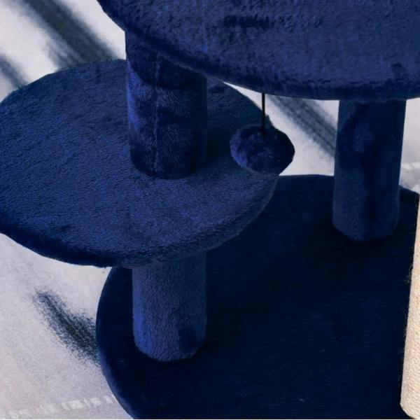 Blue plush round platform with vertical support post on a cat activity tower