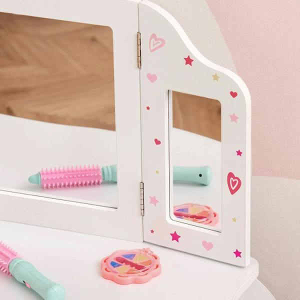 White tri-fold mirror frame with heart and star decals on kids vanity table