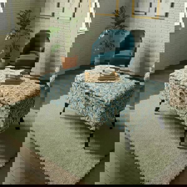 Handcrafted statement ottoman with strong black legs support