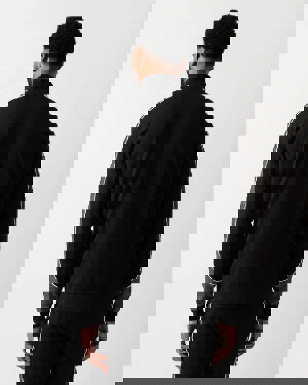 Back shot of a Model wearing a BOSS Orange Mens Full Zip Loungewear Tracksuit Jacket in Black