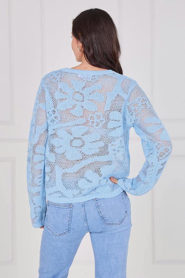 Model wearing a long sleeve crochet top with an open-knit pattern, styled with high-waisted jeans, featuring a relaxed fit and lightweight texture for casual everyday wear.