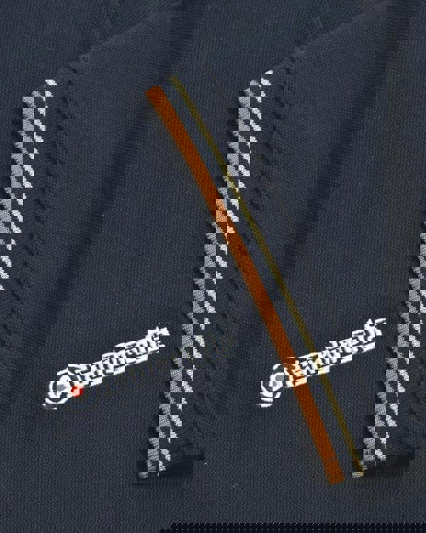 Lambretta Mens Vertical Stripe Classic Mod Ska Casual Smart Polo, close-up of navy blue polo shirt with striped collar and Lambretta logo embroidery.