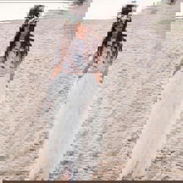 young flower girl on beach