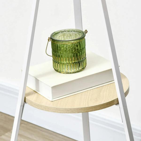 White metal coat rack with round top shelf and upright hook frame for hanging items