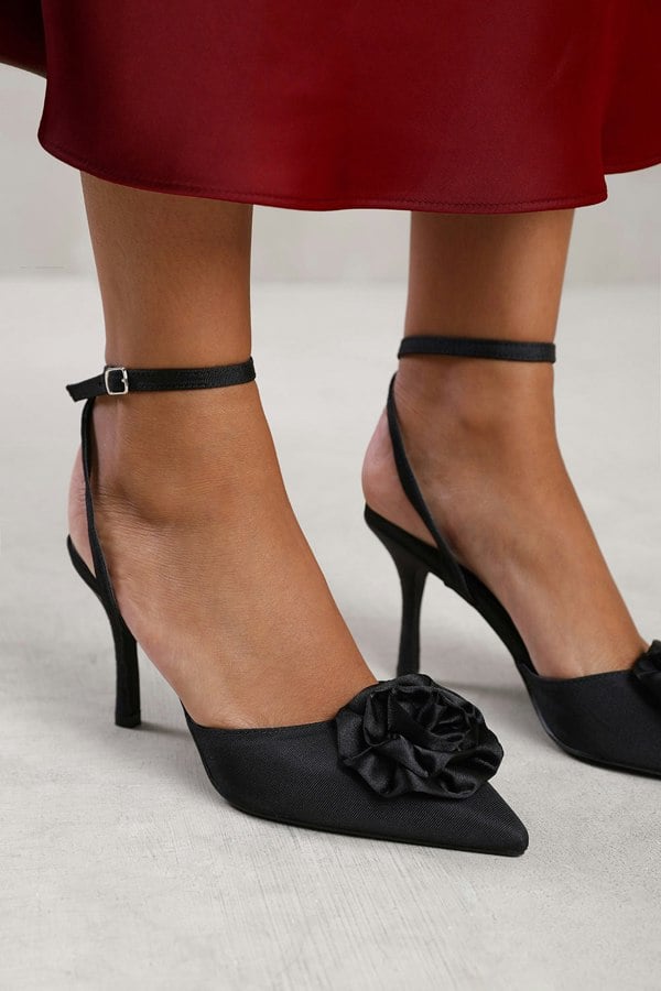 Where's That From Vienna Pointed Toe Heel With Flower Detail in Black Satin