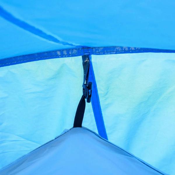 Blue tent fabric close-up with zipper and interior seam