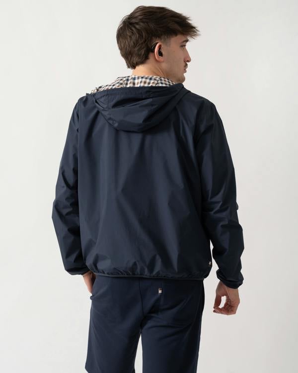 back shot of a model wearing an Aquascutum Mens RLG Badge Reversible Sailor Jacket in Navy 11