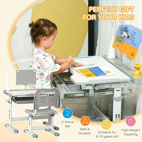 Grey kids study desk and chair set; child writing at desk with 2-piece set