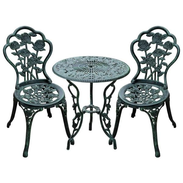Antique green cast aluminum bistro table and two chairs with floral cutout backs.