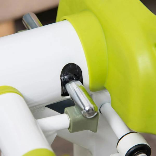Close-up of hydraulic pivot mechanism on yellow and white mini stepper