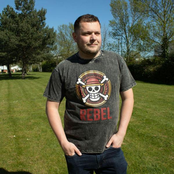 Charcoal stonewashed T-shirt worn by model with Rebel skull chest graphic