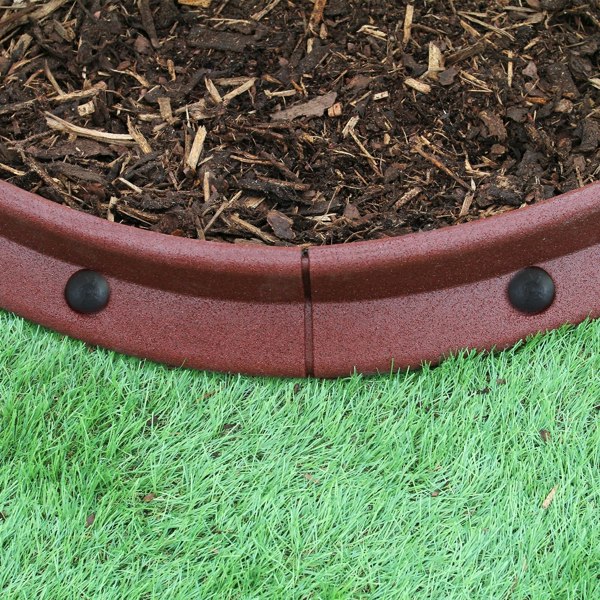 Flexible terracotta lawn edging, 1.2m long, featuring a smooth, curved design with black connectors, set against mulch and grass