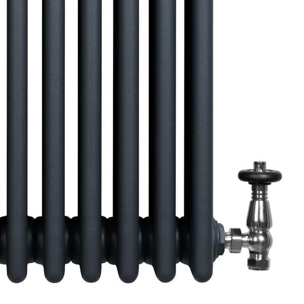Traditional anthracite grey 4 column radiator with smooth, rounded tubes and a polished valve, ideal for modern interiors