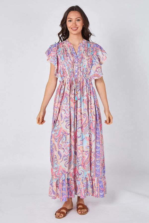 Woman wearing a colorful patterned dress on a white background