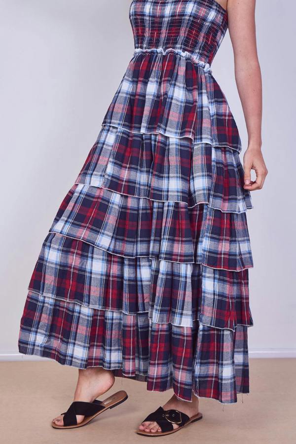 Plaid dress with tiered layers on a plain background