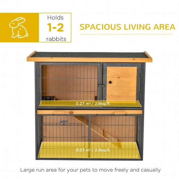 Open light yellow rabbit hutch showing two compartments and black metal frame, tray visible.