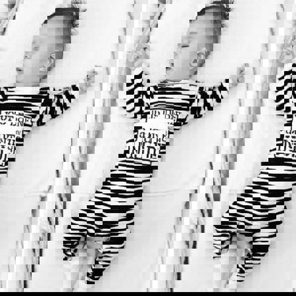 Sleeping baby wearing Just Done 9 Months Inside baby sleepsuit