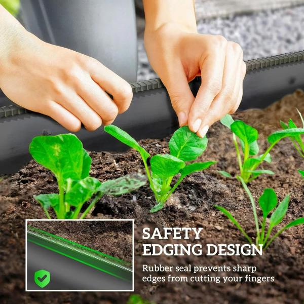 Hands planting seedlings in a dark grey metal raised bed with safety edging seal