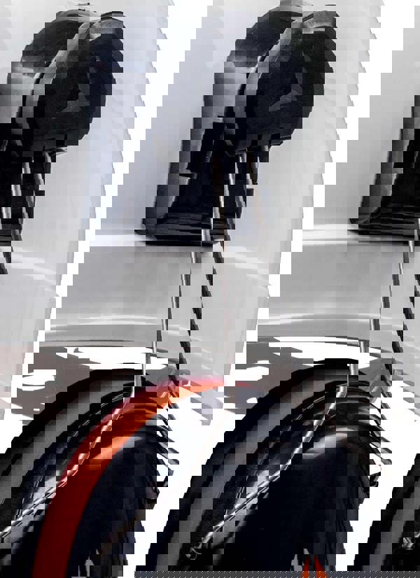 Delta Plus Delta-Plus Magny 2 Ear Muff Defender Safety PPE ABS Helmet, close-up view of black ear muff attachment with metal support and white helmet exterior.