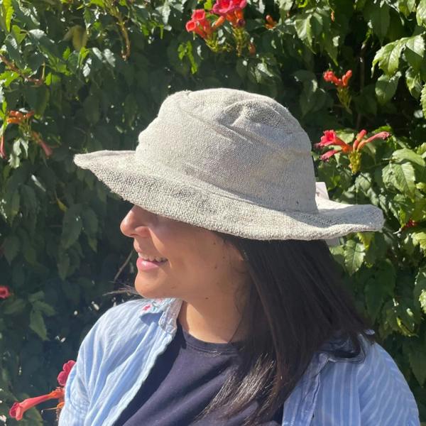 Natural wide-brim boho hat worn by model with soft floppy crown