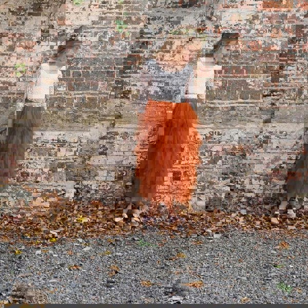 Young flower girl in pretty dress