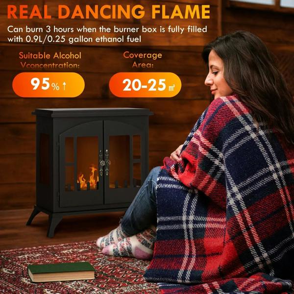 Black freestanding bioethanol stove with burning flame through glass doors