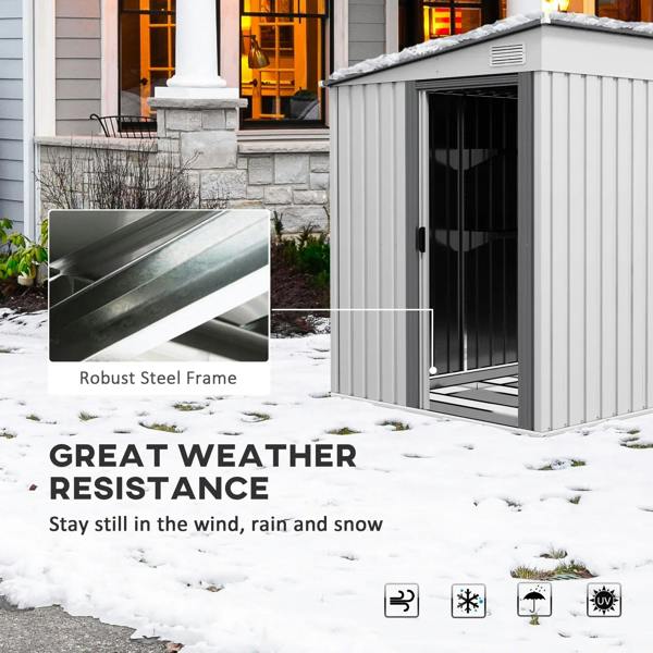 White metal shed with sliding door and robust frame in snowy outdoor setting