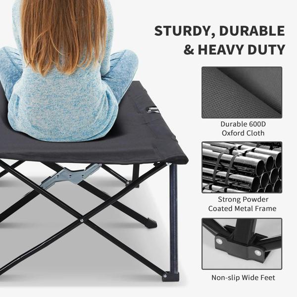 Black camping cot with black fabric sleeping surface and padded center seam, sturdy frame