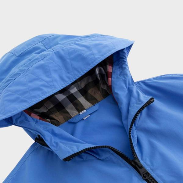 Supplied Fashion Birley long blue jacket featuring a hooded design with signature check lining and zip closure