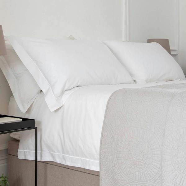 White 200 Thread Count Egyptian 40cm Deep Fitted Sheets styled in a bedroom | Soak and Sleep