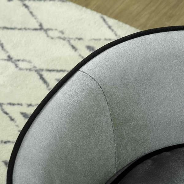 Grey upholstered pet sofa armrest with black piping and curved back