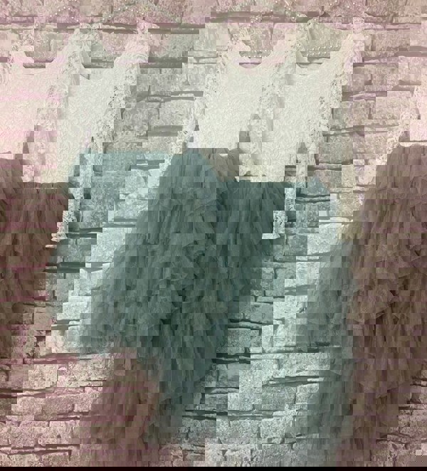 Bohemian Spirit Dresses in Sage Green on coat hangers