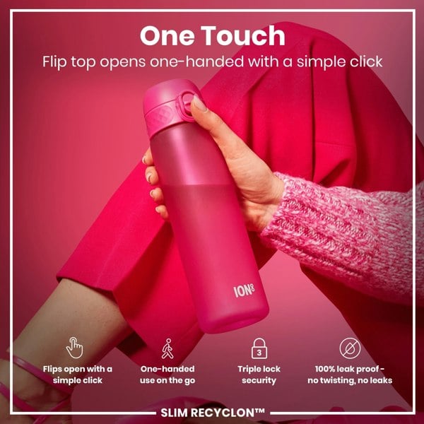 A pink water bottle is being held; its flip top is opened with one hand. The context is a pink background and clothing. One Touch. Flip top opens one-handed with a simple click. Flips open with a simple click. One-handed use on the go. Triple lock security. 100% leak proof - no twisting, no leaks. SLIM RECYCLON™.