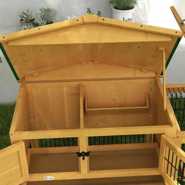 Wooden rabbit hutch interior view with upper compartment and divided lower sections