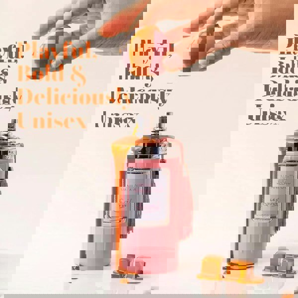 Sapil Naughty Vanilla Oud Unisex EDP 100ml  Pink perfume bottle with tassel and orange cap, hand holding cap, text 'Playful, Bold & Deliciously Unisex'.