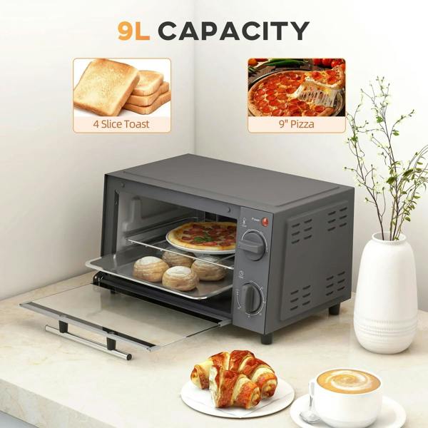 Grey countertop mini oven with open door, baking tray and wire rack, pizza and buns inside.