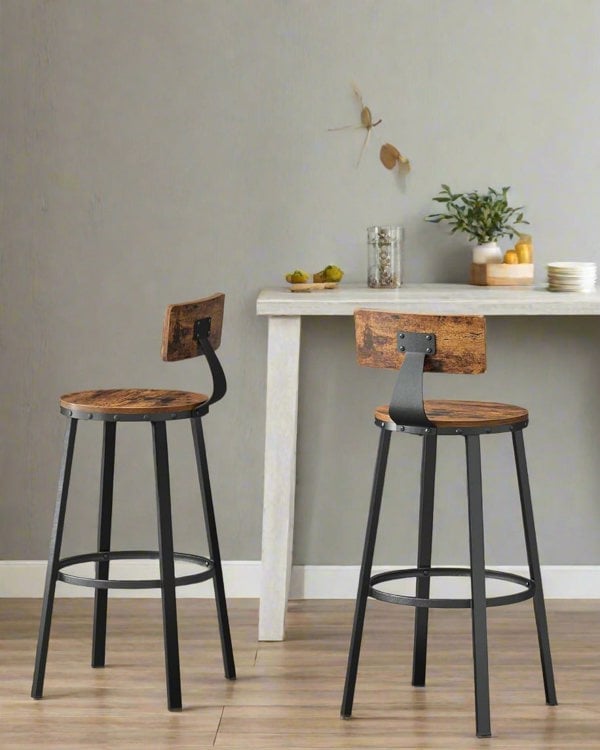 Set of 2 rustic industrial bar stools with black steel frame, curved backrests, and circular footrests

