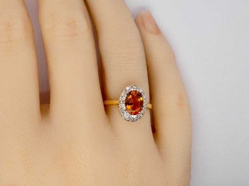 A yellow Topaz and Diamond cluster ring finger view