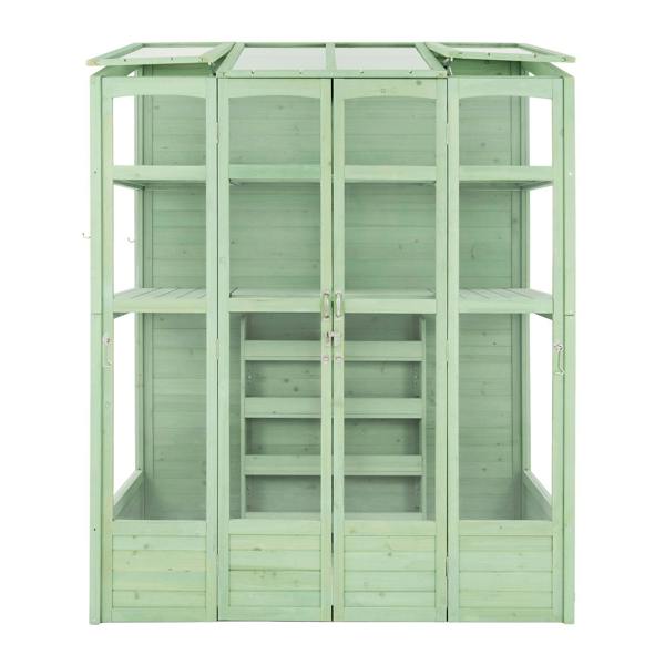 Victorian-style greenhouse in a soft green hue, featuring wooden panels, glass windows, and multiple shelves for plants