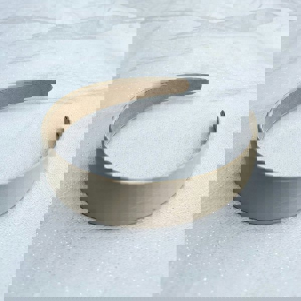 Beige hairband, smooth satin fabric, minimalist plain design, soft matte finish, structured slim style, versatile everyday accessory
