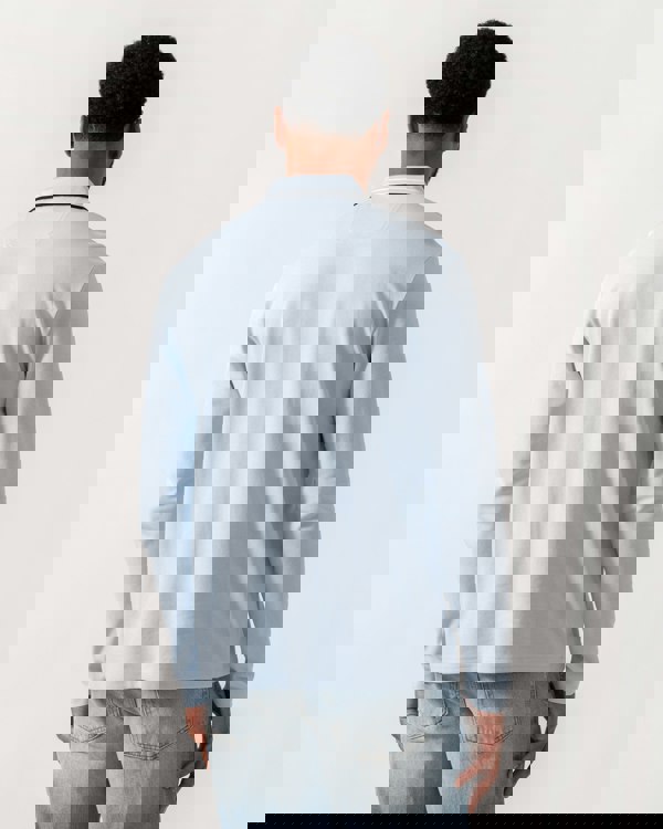 Model wearing BOSS Green Mens Plisy Long Sleeve Polo Shirt in Open Blue 464 - Back